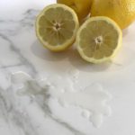 fm-distributing-cut-lemon-on-white-marble-countertops-calacatta-neolith-countertops