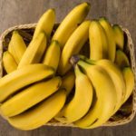 A Banch Of Bananas And A Sliced Banana