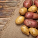 Potatoes On A Rustic Background