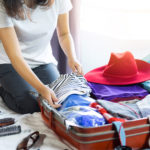 Travel And Vacation Concept, Happiness Woman Packing Stuff And A