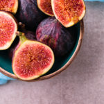 Fresh Figs. Whole Figs And Sliced In Half Figs In Ceramic Bowl.