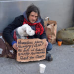 homeless-person-with-sign-dog-shutterstock_96134678