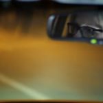 videoblocks-a-woman-in-glasses-drive-a-car-through-the-night-city-her-face-is-reflected-in-the-rearview-mirror_h_7afii9_thumbnail-small01