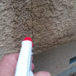 Wet-Down-Wall-Around-Crack-In-Stucco