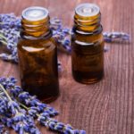 Two Bottles Of Aroma Oils And Lavender Flowers