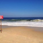 No-swimming-sign-on-Copacabana-Beach-on-a-dangerous-currents-day