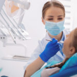 bigstock-Kind-Orthodontist-Holding-A-De-259949032