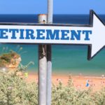 retirement-plan-arrow-sign-beach-1068×713